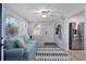 Bright sitting room with sofa, ceiling fan and large window at 7235 Maryland Ave, Hudson, FL 34667