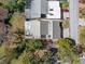 Overhead aerial view of property showing roof, driveway and mature surrounding landscape at 7514 Rocky Point Dr, Hudson, FL 34667
