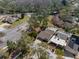 An aerial view of a residential neighborhood with mature trees and well-maintained lawns at 7514 Rocky Point Dr, Hudson, FL 34667