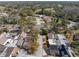 Aerial shot of homes in a neighborhood featuring mature trees and nearby roadways at 7514 Rocky Point Dr, Hudson, FL 34667