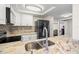 Modern kitchen featuring stainless steel appliances, granite countertops, and stylish backsplash at 7514 Rocky Point Dr, Hudson, FL 34667