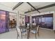 Covered patio with dining table and chairs, seamlessly connected to indoor spaces at 7514 Rocky Point Dr, Hudson, FL 34667
