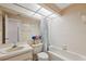 Bathroom with a tub, toilet, sink, and large mirror at 7546 St Andrews Blvd, Weeki Wachee, FL 34613