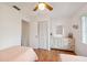 Bedroom featuring two twin beds, ceiling fan, and natural light at 7546 St Andrews Blvd, Weeki Wachee, FL 34613