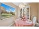 Cozy breakfast nook with an outside view, adorned with a pink tablecloth at 7546 St Andrews Blvd, Weeki Wachee, FL 34613