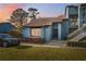 Charming townhouse featuring a well-maintained lawn and neatly trimmed shrubbery at 7546 St Andrews Blvd, Weeki Wachee, FL 34613