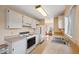 Bright kitchen with wooden counters and white cabinets leads to the dining area at 7546 St Andrews Blvd, Weeki Wachee, FL 34613
