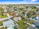 Aerial view of a residential neighborhood showcasing well-maintained homes and mature trees at 7810 Putnam Cir, New Port Richey, FL 34655