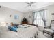 Bedroom with carpeted floors, ceiling fan, and natural light at 7810 Putnam Cir, New Port Richey, FL 34655