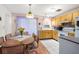 Kitchen and dining area featuring wood cabinetry and a view to the backyard at 7810 Putnam Cir, New Port Richey, FL 34655