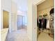 Main bathroom has neutral tile, separate toilet closet, walk-in shower, and walk-in closet at 8447 Pavilion Dr, Hudson, FL 34667