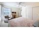 Bedroom featuring soft carpet, neutral walls, a small desk, and closet at 8447 Pavilion Dr, Hudson, FL 34667