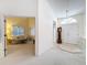 Welcoming foyer with double front doors, a decorative rug, and an antique grandfather clock at 8447 Pavilion Dr, Hudson, FL 34667