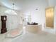 Welcoming foyer with tile flooring, high ceilings, and dining area adjacent to the front entry at 8447 Pavilion Dr, Hudson, FL 34667