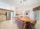 Open concept kitchen with stainless appliances overlooks the breakfast nook and table at 8447 Pavilion Dr, Hudson, FL 34667