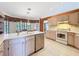 Bright kitchen with sleek appliances, ample counter space, and an adjacent dining area by a large picture window at 8447 Pavilion Dr, Hudson, FL 34667