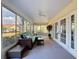 Bright lanai with plenty of natural light, a ceiling fan, and cozy wicker furniture at 8447 Pavilion Dr, Hudson, FL 34667
