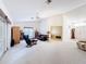 Spacious living room with high ceilings, natural light, and comfortable seating arrangements at 8447 Pavilion Dr, Hudson, FL 34667