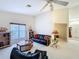 Spacious living room with high ceilings, natural light, and comfortable seating arrangements at 8447 Pavilion Dr, Hudson, FL 34667