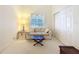 Cozy living room with vaulted ceilings, natural light, and a comfortable sofa at 8447 Pavilion Dr, Hudson, FL 34667