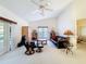 Spacious living room with high ceilings, natural light, and comfortable seating arrangements at 8447 Pavilion Dr, Hudson, FL 34667