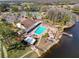 Aerial view of the Heritage Lake community clubhouse, pool, and surrounding amenities at 9332 Whitstone Ct, New Port Richey, FL 34655