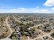 High angle view of a residential neighborhood featuring neatly arranged homes, paved streets and verdant trees on a bright day at 11081 Montcalm Rd, Spring Hill, FL 34608