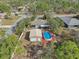 Aerial view of a house with an above ground pool and detached metal garage at 13083 Jaywalk Rd, Brooksville, FL 34614