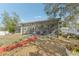 Backyard view featuring the screened patio and picnic table of the property at 13083 Jaywalk Rd, Brooksville, FL 34614