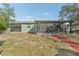 Backyard view featuring the screened patio and spacious yard area of the property at 13083 Jaywalk Rd, Brooksville, FL 34614