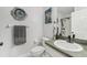 This full bathroom features a modern toilet, sink and faucet as well as stylish decor at 13083 Jaywalk Rd, Brooksville, FL 34614