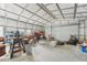 Interior of the detached garage/workshop with plenty of space for vehicles and projects at 13083 Jaywalk Rd, Brooksville, FL 34614