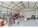 Spacious metal garage with roll up doors and plenty of room for storage or workshop area at 13083 Jaywalk Rd, Brooksville, FL 34614