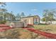 View of the detached garage/workshop and above-ground pool in the backyard at 13083 Jaywalk Rd, Brooksville, FL 34614