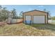 View of the detached garage/workshop and above-ground pool in the backyard at 13083 Jaywalk Rd, Brooksville, FL 34614