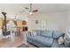 Inviting living room with a comfortable sofa, wood-burning stove, and a dining area at 13083 Jaywalk Rd, Brooksville, FL 34614