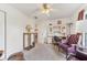 Office includes a desk and chair, a ceiling fan, carpeted floor, and natural light from the window at 13083 Jaywalk Rd, Brooksville, FL 34614