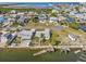 Aerial view of a waterfront community with canal access, showcasing the home's prime location and boating opportunities at 13428 Sunfish Dr, Hudson, FL 34667