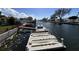 Dock with boat lift provides access to waterways, perfect for boating and water activities at 13603 Jennita Dr, Hudson, FL 34667