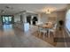 Bright open kitchen with modern appliances, granite countertops, and adjacent dining area for seamless entertaining at 13603 Jennita Dr, Hudson, FL 34667