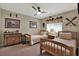 Cozy bedroom featuring two twin beds, a ceiling fan, and aviation-themed decor at 1406 Overland Dr, Spring Hill, FL 34608