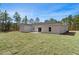 Expansive backyard view with a well-maintained lawn, perfect for outdoor activities at 18020 Macek Rd, Weeki Wachee, FL 34614
