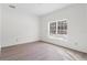 Bedroom featuring large window that lets in ample natural light at 18020 Macek Rd, Weeki Wachee, FL 34614
