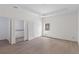 Bright bedroom with tray ceiling, a large window, and an ensuite bathroom at 18020 Macek Rd, Weeki Wachee, FL 34614