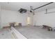 Spacious two car garage, equipped with an automatic door opener and ample storage space at 18020 Macek Rd, Weeki Wachee, FL 34614