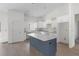 Spacious kitchen design boasting a large island, ample white cabinetry, and recessed lighting at 18020 Macek Rd, Weeki Wachee, FL 34614