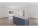 Large, bright living area featuring a dark blue island, granite countertops, and lots of space at 18020 Macek Rd, Weeki Wachee, FL 34614