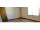 A bright bedroom featuring wood floors and a window with blinds at 2013 Meredith Dr, Spring Hill, FL 34608
