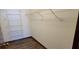 A closet showing wood floors and shelving at 2013 Meredith Dr, Spring Hill, FL 34608