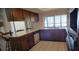 Kitchen area featuring vintage wood cabinetry and a breakfast bar at 2013 Meredith Dr, Spring Hill, FL 34608